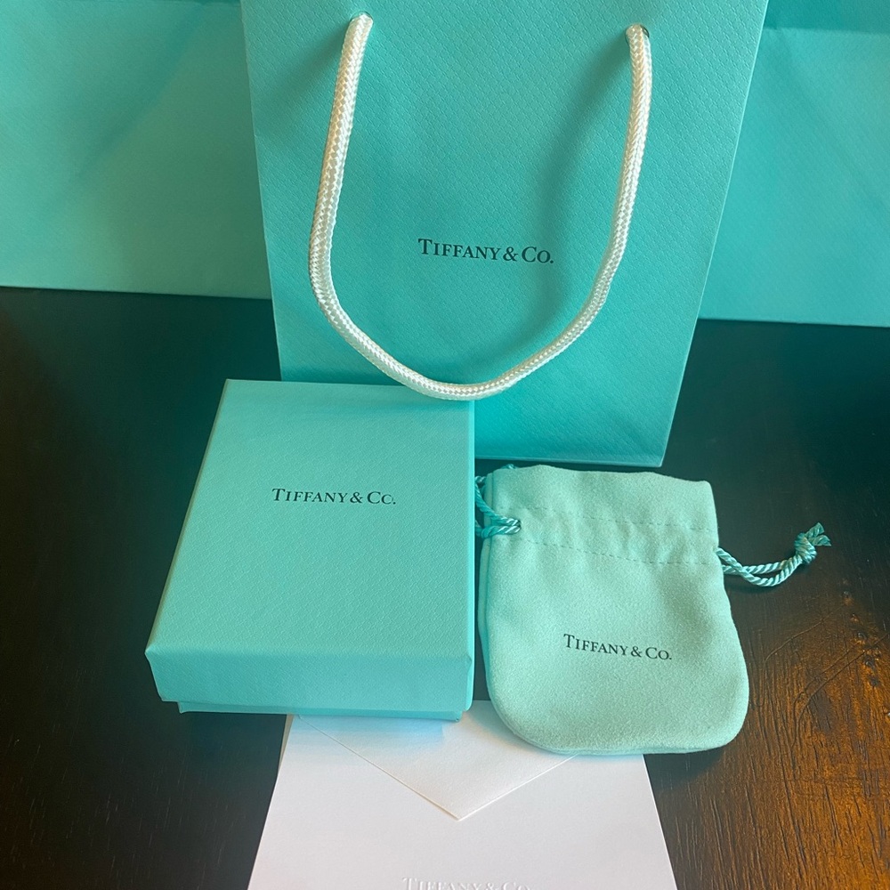 Tiffany & Co. Authentic, New. Box, pouch,bag & note card with envelope.